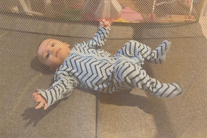 Baby through mesh on Tutti Bambini CoZee Go travel cot Baby through mesh on Tutti Bambini CoZee Go travel cot