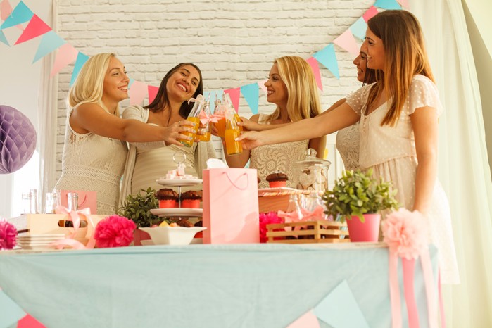 Making celebratory toast to baby's health