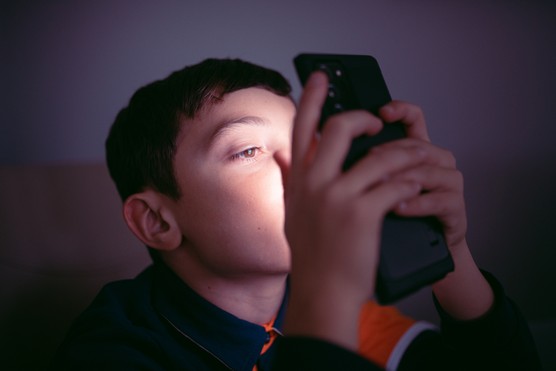 Boy Engrossed on Phone