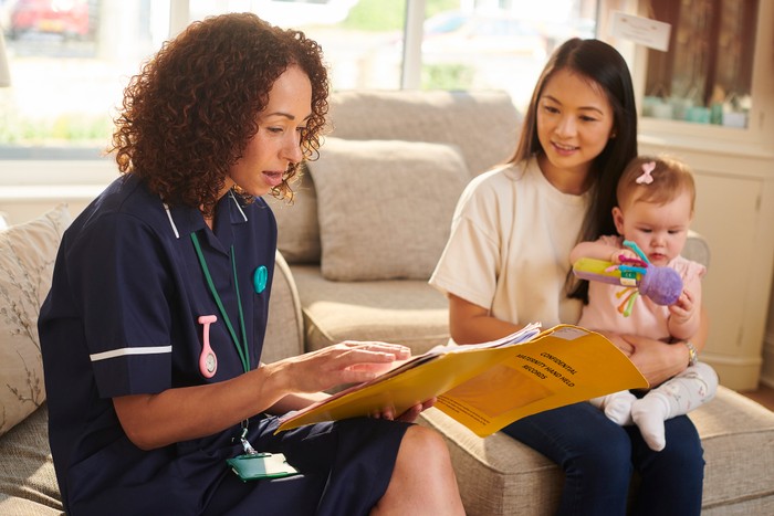 checking baby's progress health visitor visit