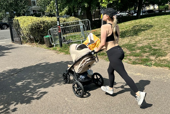 Reviewer running with Cybex Avi Spin pushchair
