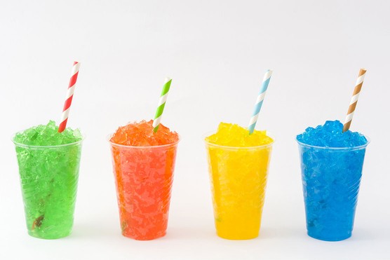slushy drinks in different colours lined up in a row