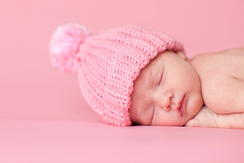 unique-girl-names newborn girl in pink hat