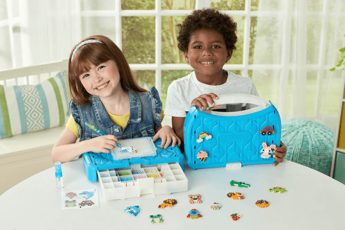 Aquabeads children playing with Aquabeads kit